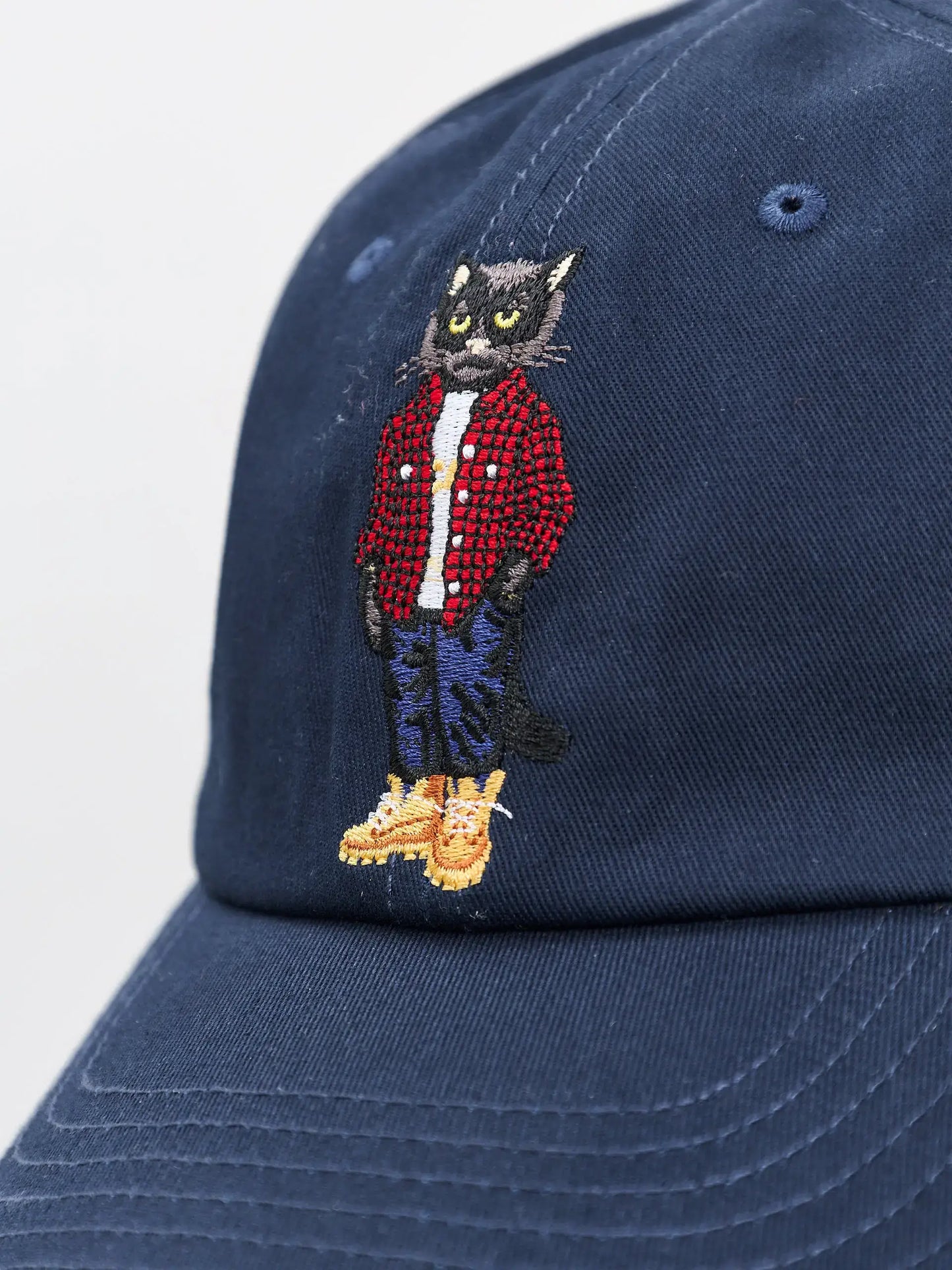 Set: men’s blue T-shirt with a mini print of a black COUNTRY CAT and a dark blue cap with Cat embroidery