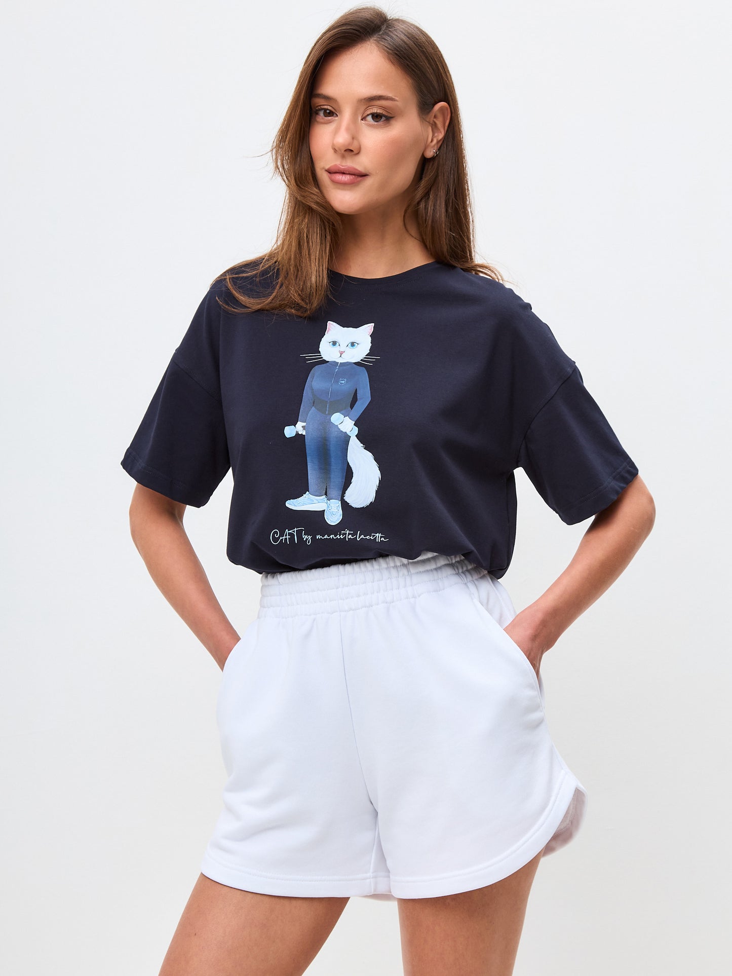 Set: women's dark blue oversized T-shirt with a white sports Cat and white shorts