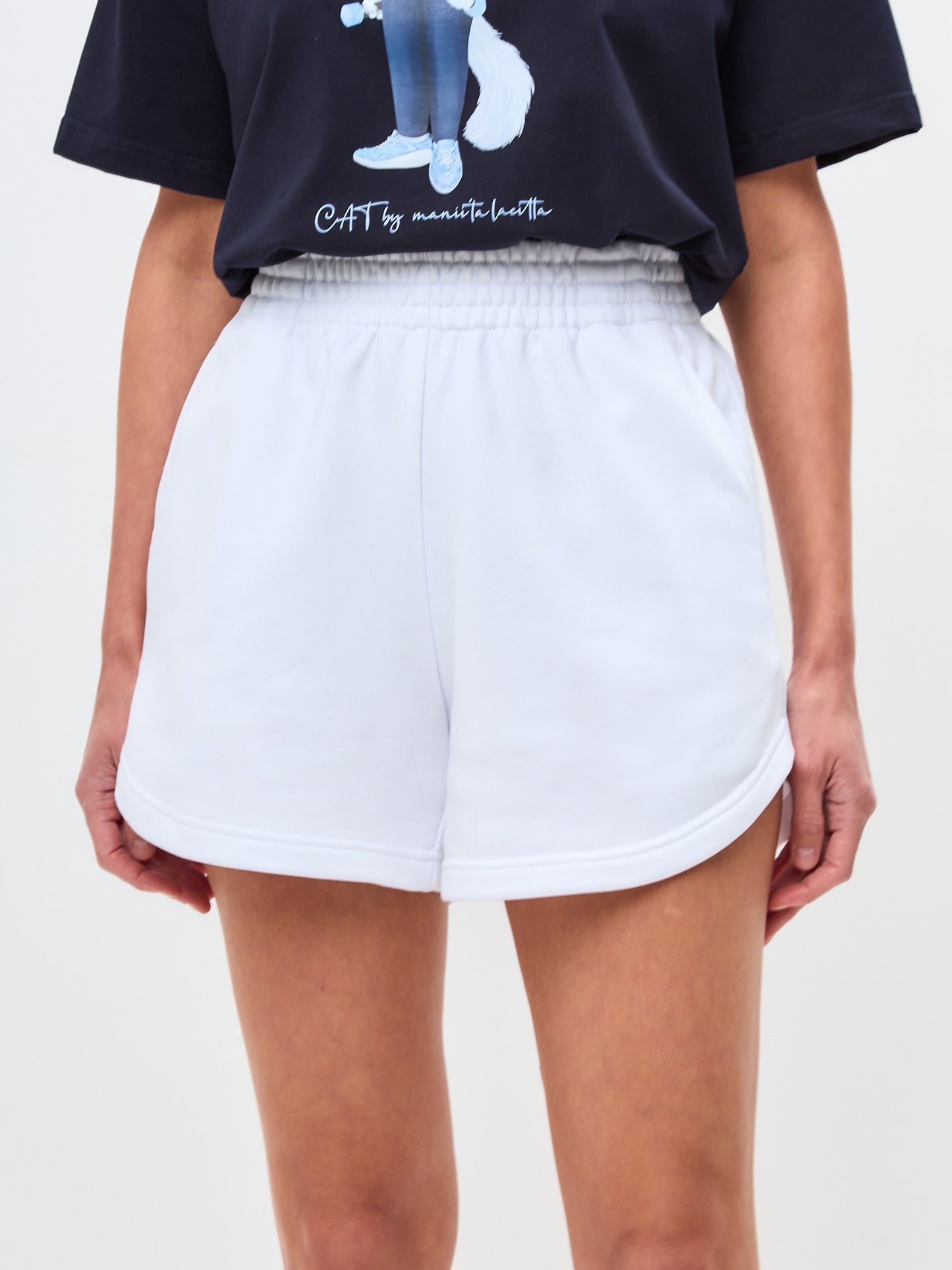 Set: women's dark blue oversized T-shirt with a white sports Cat and white shorts