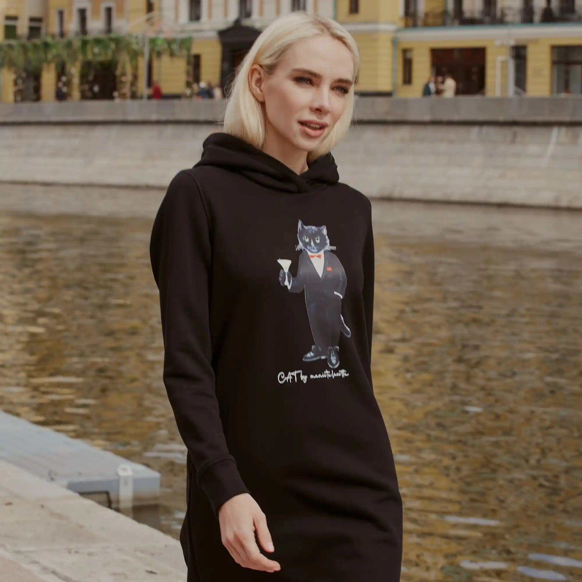 Black hooded dress with cat graphic.