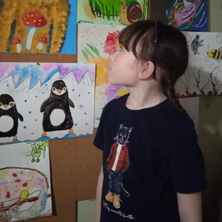 Child’s black t-shirt with cat graphic.