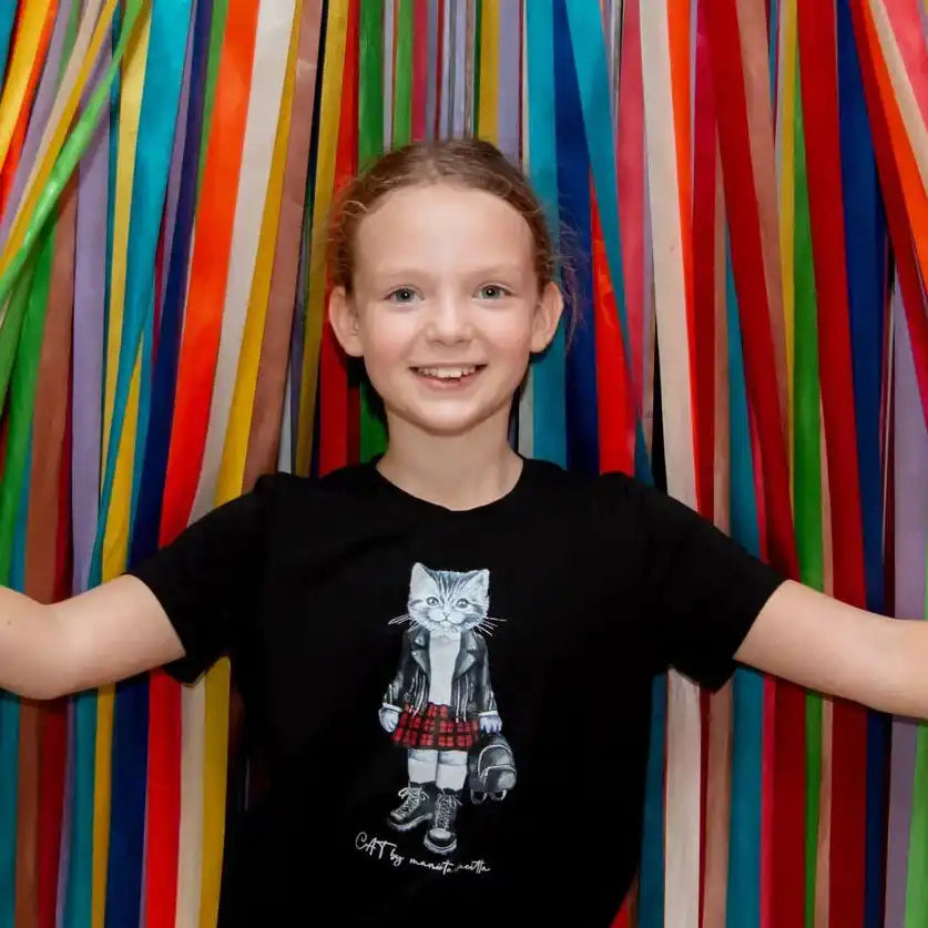 Girl’s black t-shirt with cat graphic.