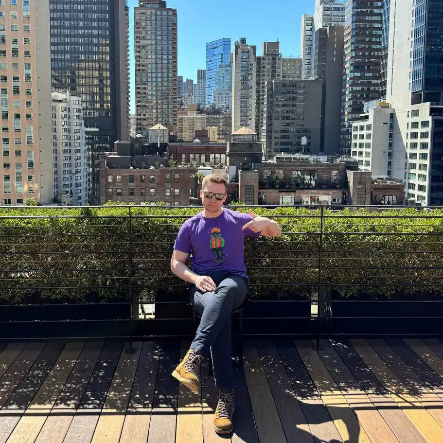 Man in purple t-shirt.