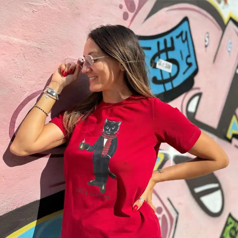 Red t-shirt with cat graphic.