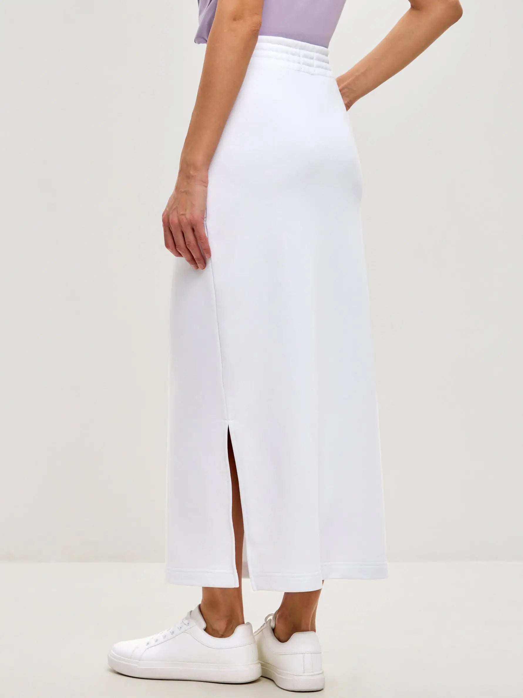Set: women’s purple T-shirt with a white sport-casual skirt