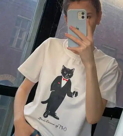 White t-shirt with a tuxedo cat graphic.
