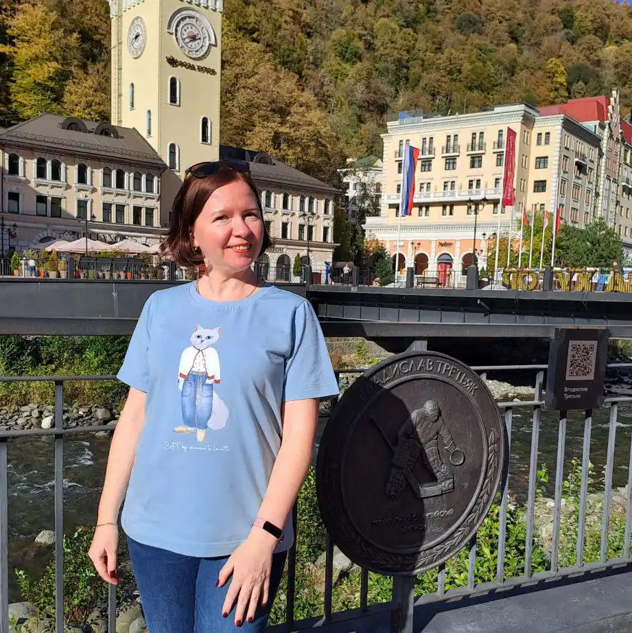 Woman wearing a cat t-shirt.