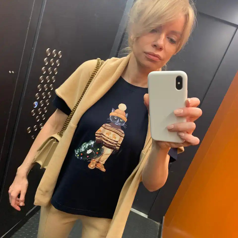 Woman in a cat-themed t-shirt.