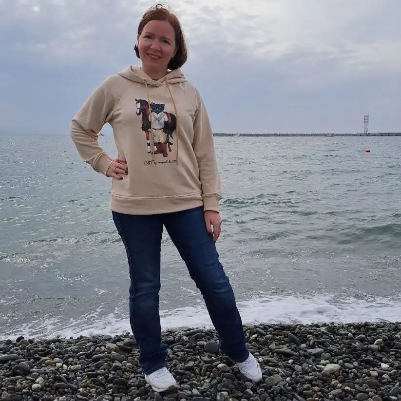 Woman in a hooded sweatshirt.