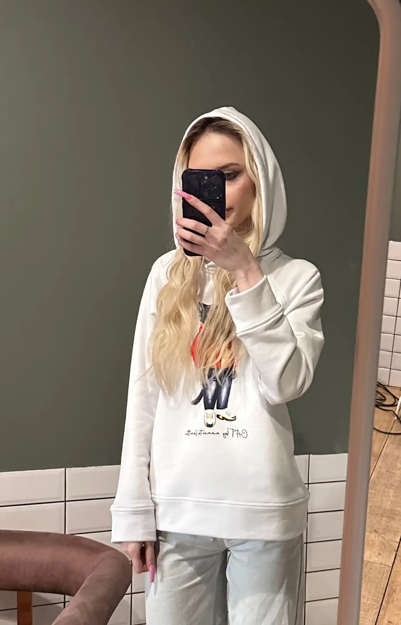 Woman in white hoodie.